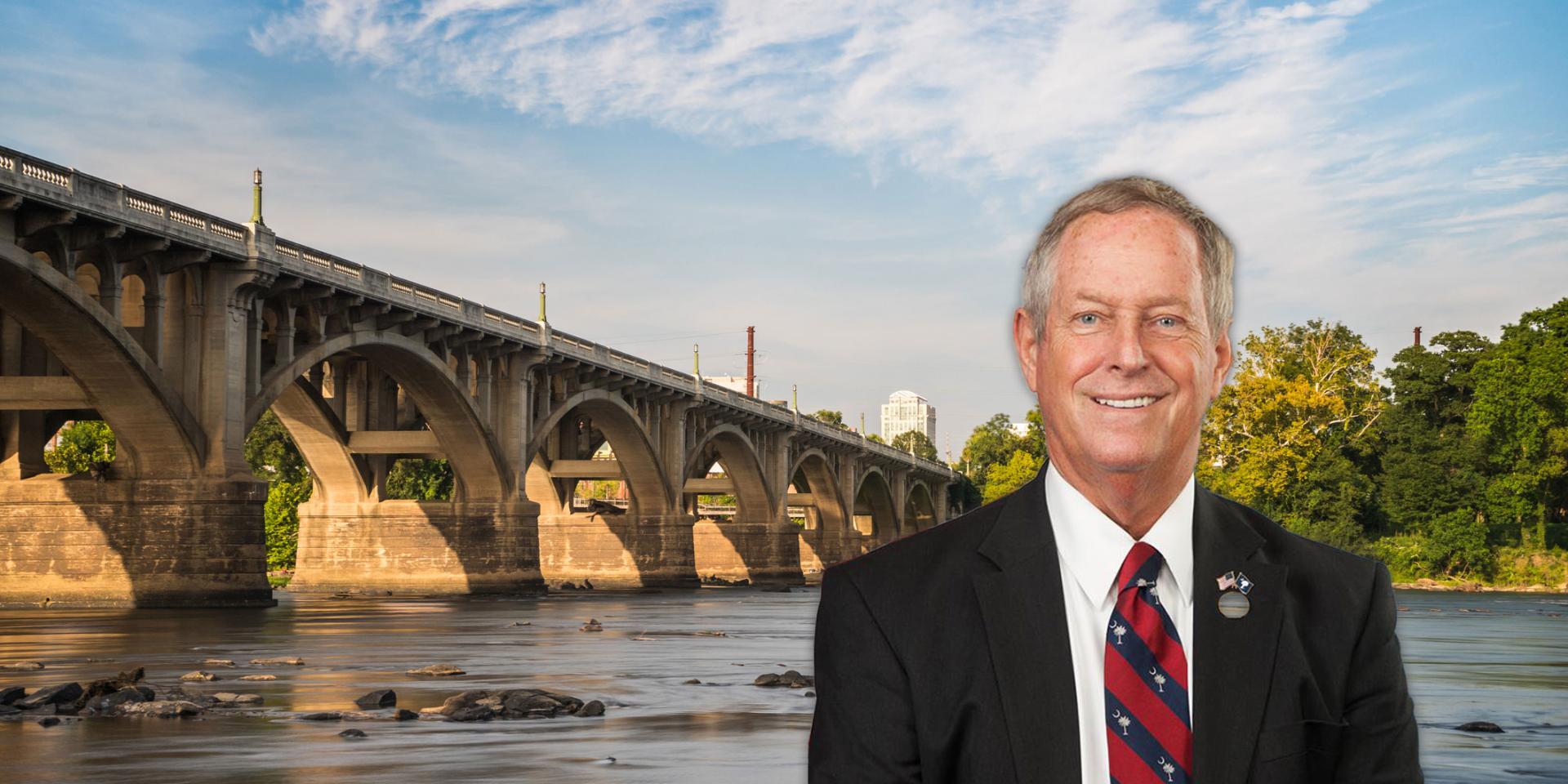 Profile photo of Congressman Joe Wilson in front of a scenic view of a bridge